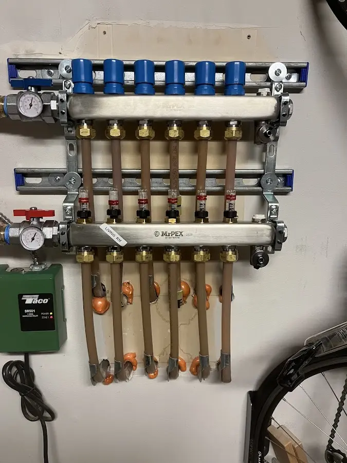 Plumber performing Water Heater Repair at a residential property in Briarcliff Manor